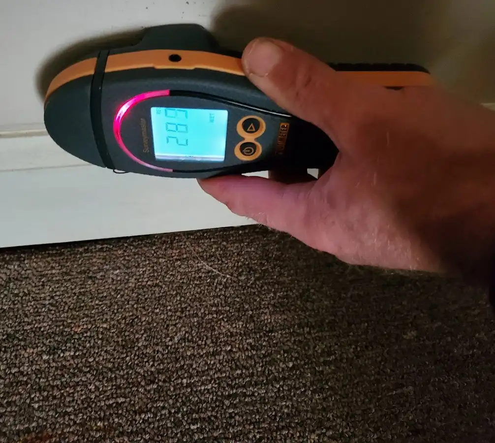 Moisture detection at baseboard during Storm Damage Restoration in Mentor-on-the-Lake